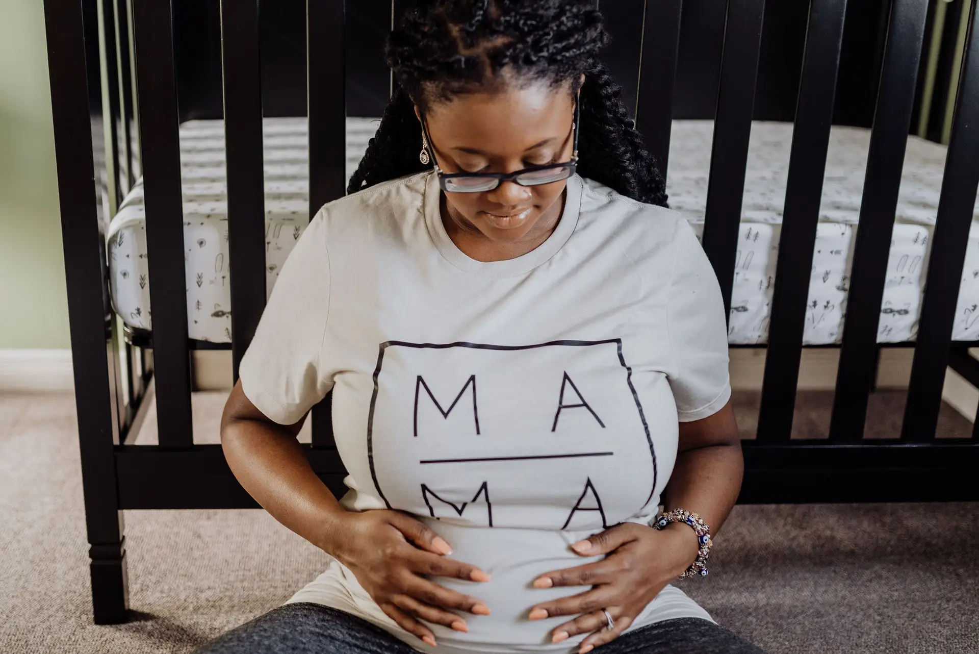 Black pregnant mum, doing pregnancy yoga