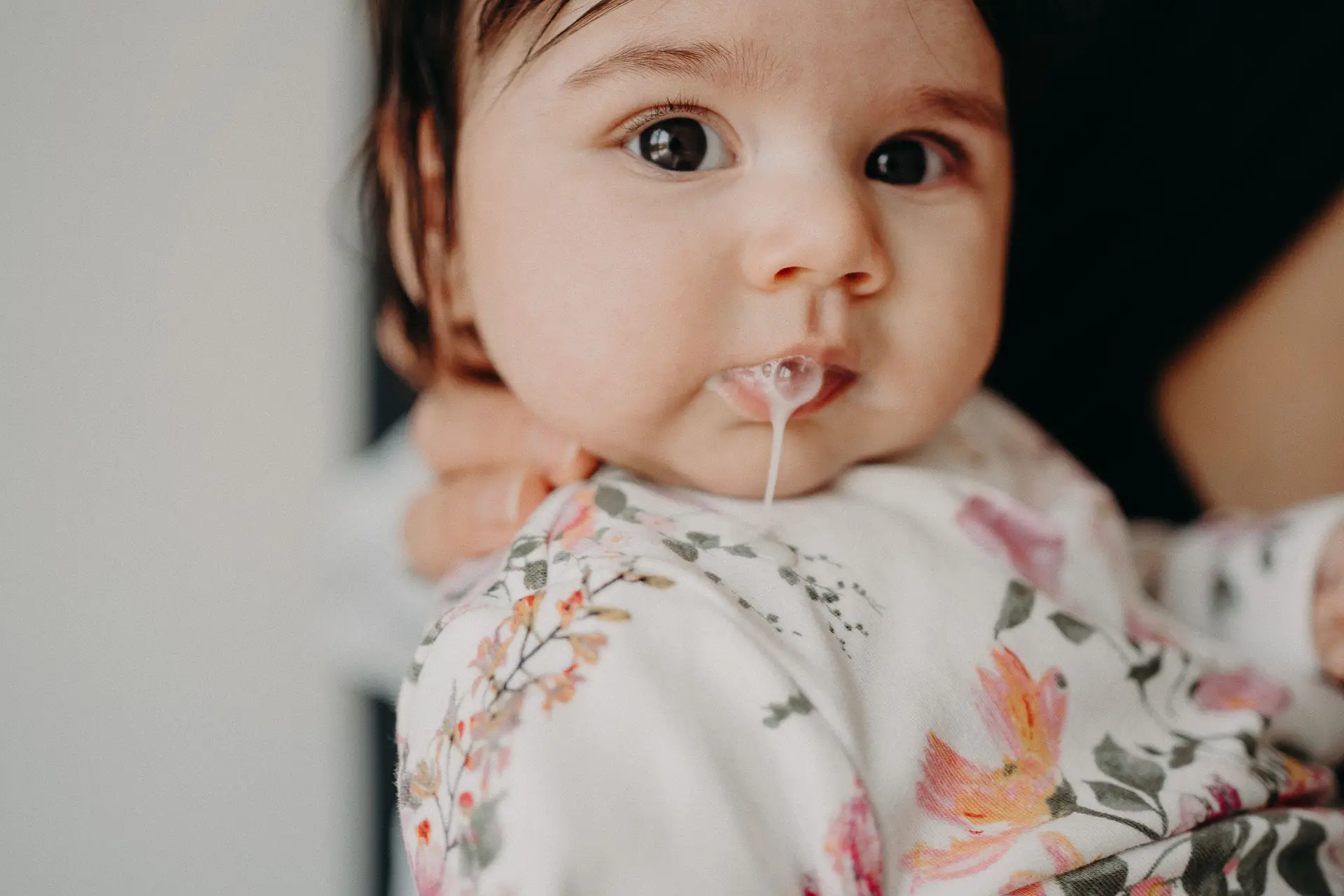 Baby with lots of dark hair and reflux